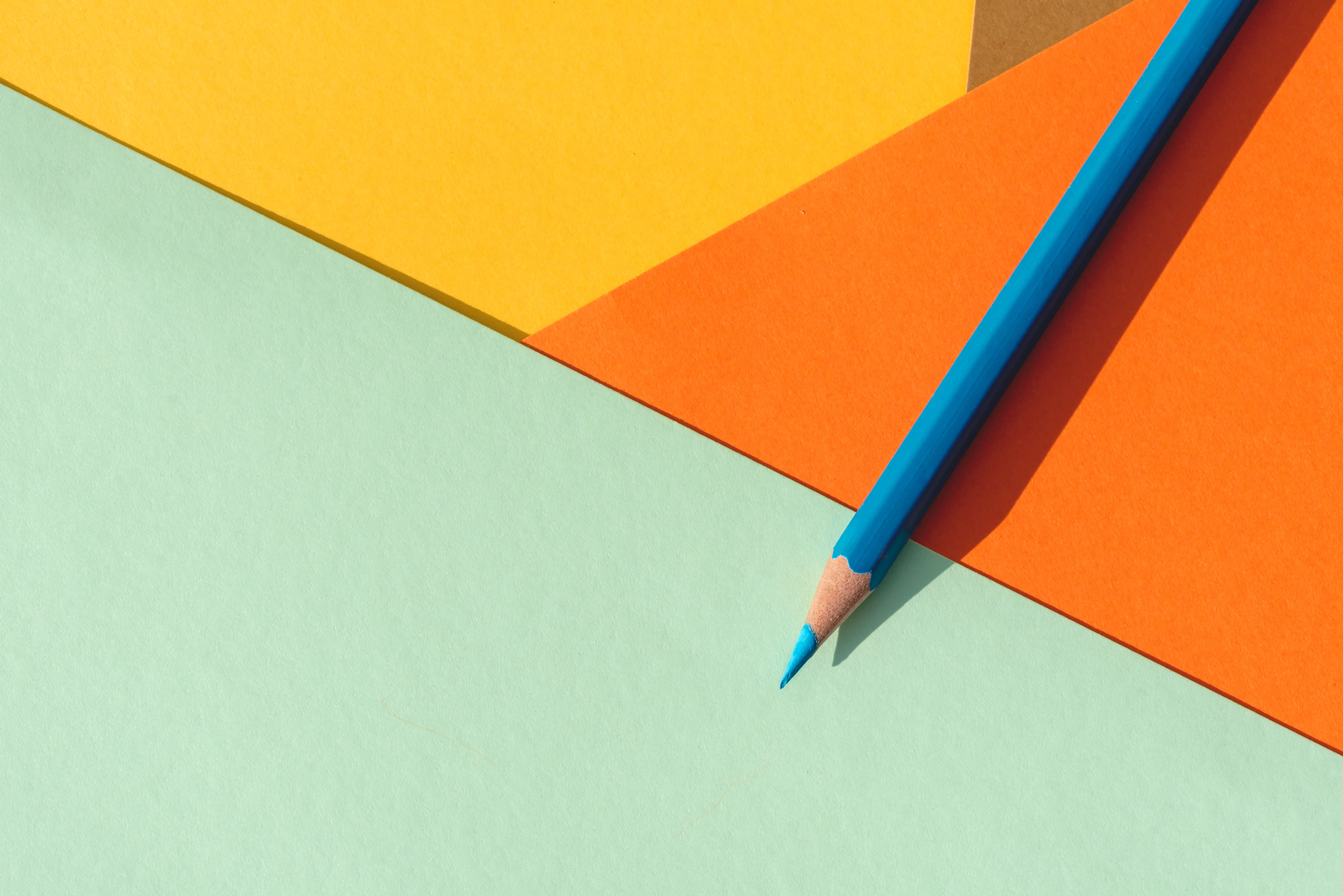 A bright design desk with colour swatches and a pencil